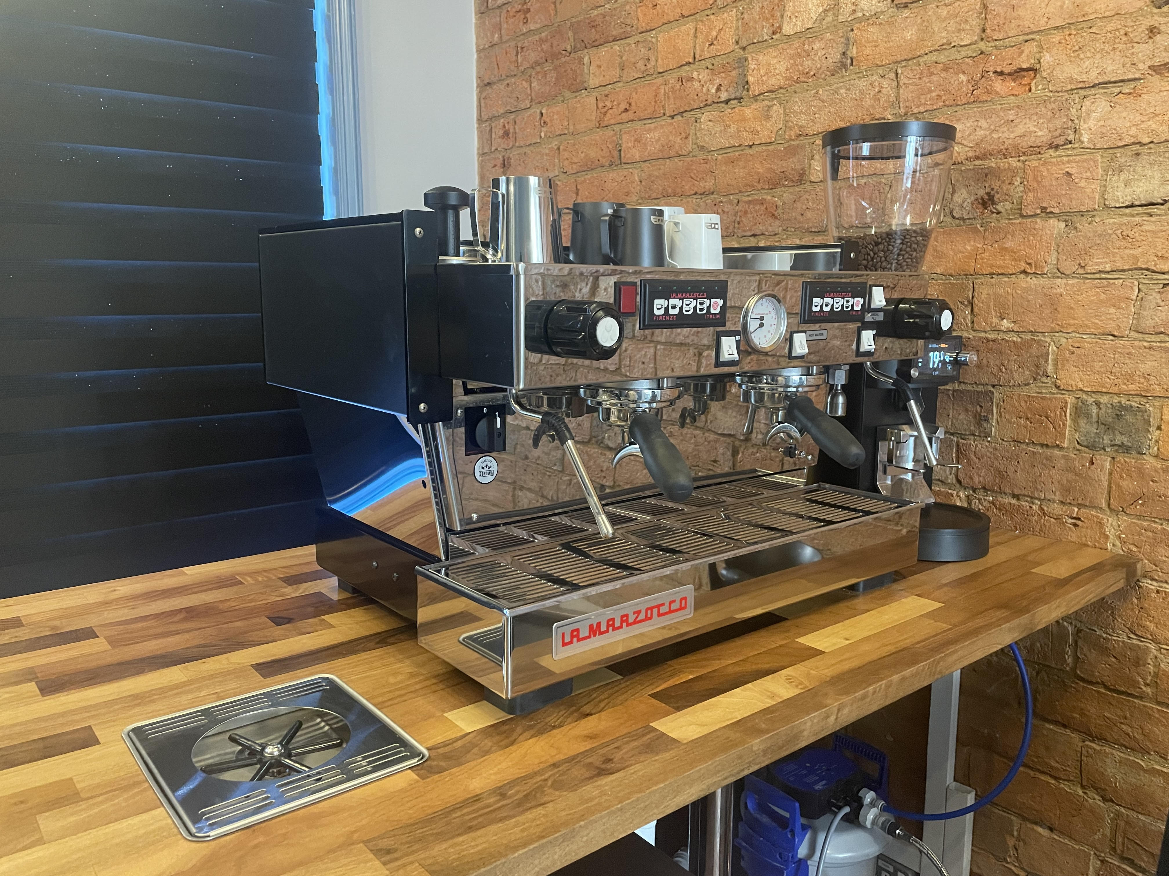 Espresso coffee being made using coffee machine
